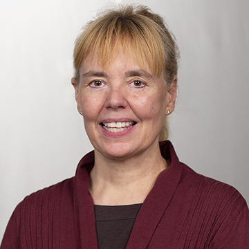 A student posing on top of giant letters during a Study abroad in Amsterdam.
