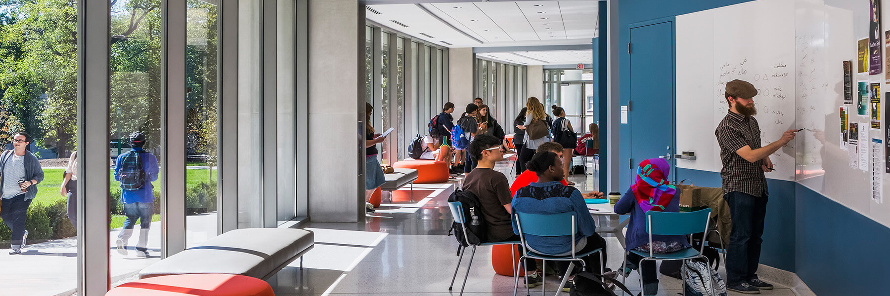 GISB Building Interior at Indiana University with students talking.