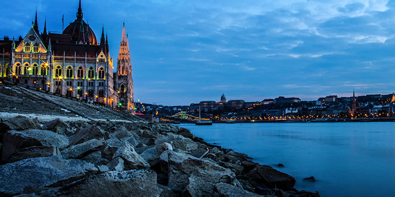 Night time European city by the rocks